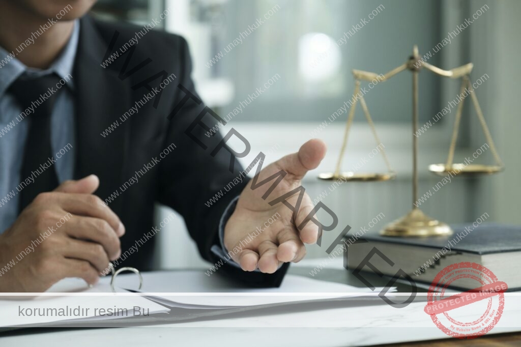 Male lawyer in the office with brass scale.